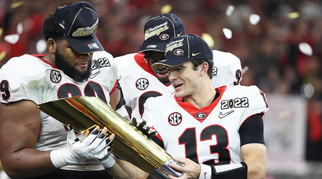 Jordan Davis and Stetson Bennett holding National Championship Trophy | Credit: <a href="https://athlonsports.com/college-football/georgia-football-can-bulldogs-repeat-national-champions-2022">Trevor Ruszkowski-USA TODAY Sports</a>