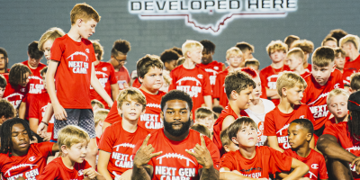 Miyan Williams with the kids at the Next Gen Youth Football Camp at the Woody Hayes Athletic Center