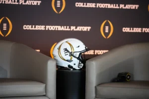 College Football Playoff Helmet Press Conference Stage | Image Credit: NY Post