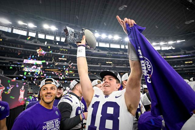 Kansas State quarterback Will Howard (18) holds up the 2022 Big 12 championship trophy after the Wildcats beat TCU in overtime at AT&T Stadium. Image Credit: Yahoo Sports
