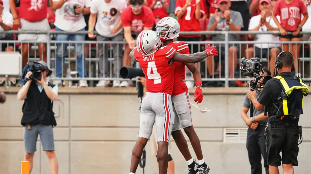 Ohio State Buckeyes wide receiver Jeremiah Smith (4) celebrates a touchdown by wide receiver Carnell Tate (17) during the second half of the NCAA football game against the Akron Zips at Ohio Stadium. Ohio State won 52-6. | Photo Credit: Clutch Points/Benjamin Adducchio