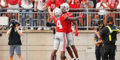 Ohio State Buckeyes wide receiver Jeremiah Smith (4) celebrates a touchdown by wide receiver Carnell Tate (17) during the second half of the NCAA football game against the Akron Zips at Ohio Stadium. Ohio State won 52-6. | Photo Credit: Clutch Points/Benjamin Adducchio