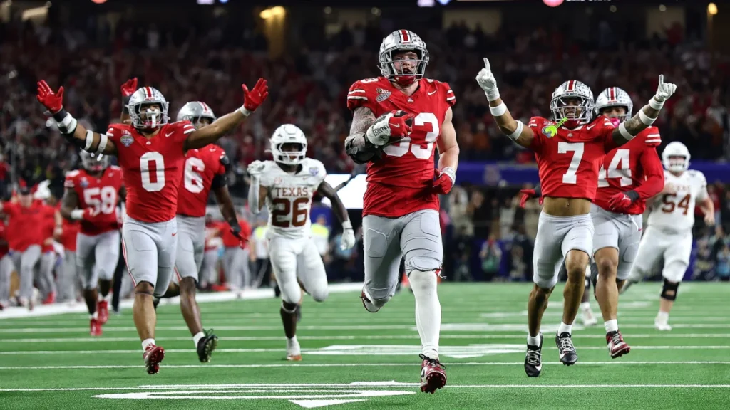 Jack Sawyer of the Ohio State Buckeyes runs with the ball after recovering a fumble in the fourth quarter against the Texas Longhorns. Photo Credit: Alex Slitz/Getty Images