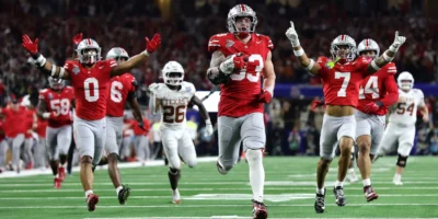 Jack Sawyer of the Ohio State Buckeyes runs with the ball after recovering a fumble in the fourth quarter against the Texas Longhorns. Photo Credit: Alex Slitz/Getty Images