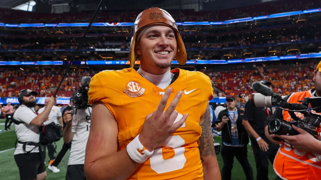 Aug 30, 2025; Atlanta, Georgia, USA; Tennessee Volunteers quarterback Joey Aguilar (6) celebrates with the old leather helmet after a victory against the Syracuse Orange at Mercedes-Benz Stadium. Mandatory Credit: Brett Davis-Imagn Images | Brett Davis-Imagn Images