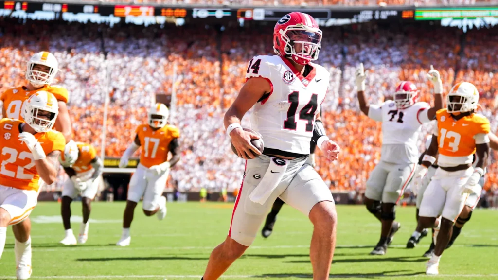 Georgia quarterback Gunner Stockton (14) runs into the end zone for a touchdown during a college football game between Tennessee and Georgia at Neyland Stadium in Knoxville, Tenn., on Sept. 13, 2025. / Brianna Paciorka/News Sentinel / USA TODAY NETWORK via Imagn Images