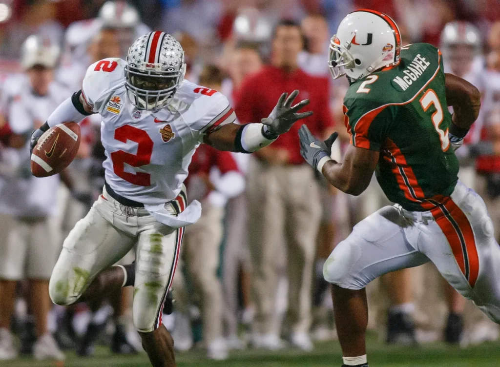 Ohio State's safety Mike Doss (left) prepares to stop Miami's Willis McGahee after Doss intercepted the ball in the second quarter of the National Football Championships at the Sun Devil Stadium in Tempe, Arizona, Jan. 3, 2003.Chris Russell, COLUMBUS DISPATCH