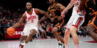Ohio State Buckeyes guard Bruce Thornton (2) drives past USC Trojans guard Kam Woods (13) during the first half of the NCAA men's basketball game at the Schottenstein Center on Feb. 11, 2026. Adam Cairns/Columbus Dispatch