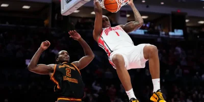 Ohio State Buckeyes forward Amare Bynum (1) dunks over USC Trojans forward Ezra Ausar (2) during the second half of the NCAA men's basketball game at the Schottenstein Center on Feb. 11, 2026. Ohio State won 89-82. Adam Cairns/Columbus Dispatch