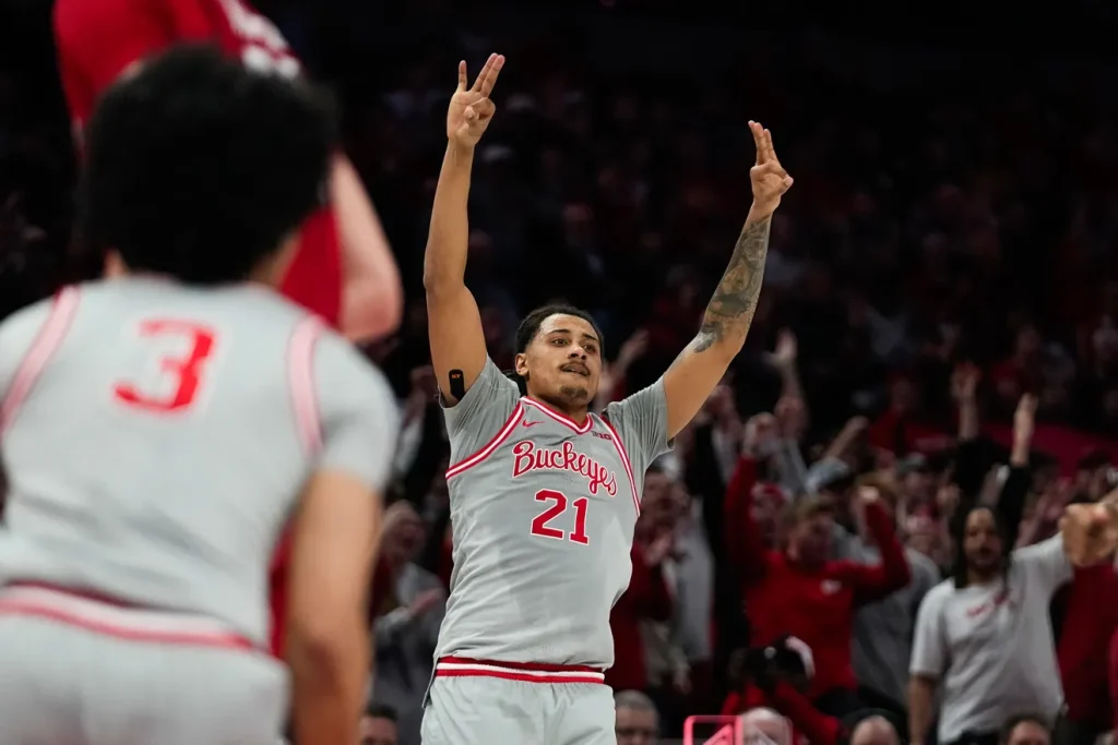 Ohio State Buckeyes forward Devin Royal (21) reacts after making a three point shot against the Wisconsin Badgers in the second half of the NCAA game at Value City Arena on Tuesday, Feb. 17, 2026 in Columbus, Ohio. Samantha Madar/Columbus Dispatch
