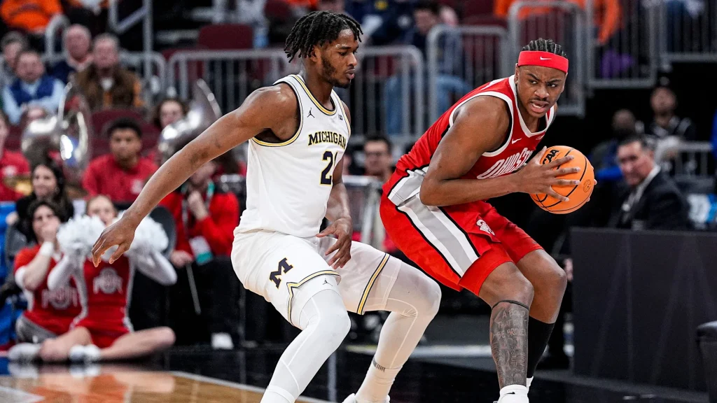 Michigan forward Morez Johnson Jr. (21) defends Ohio State forward Amare Bynum (1) during the second half of Big Ten tournament quarterfinal at United Center in Chicago on Friday, March 13, 2026. | Junfu Han / USA TODAY NETWORK via Imagn Images