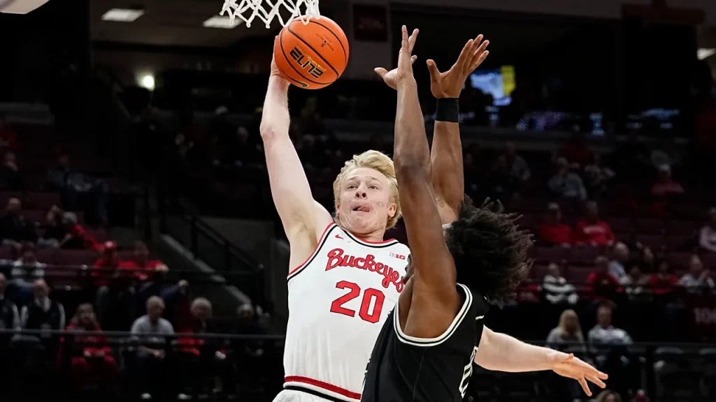 Colin White leaps over defender