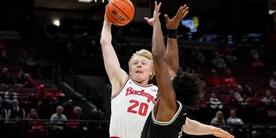 Colin White slam dunks over defender