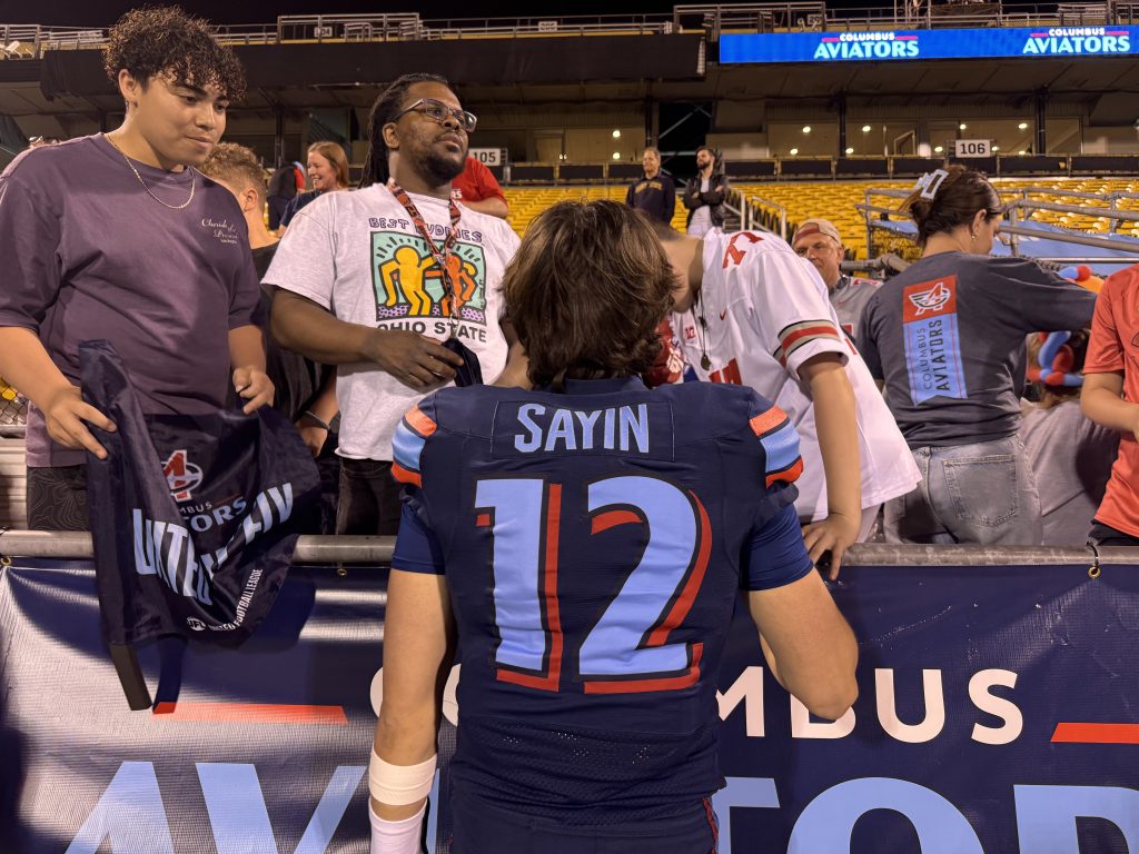 Aidan Sayin with fans after the Columbus Aviators win their first game of the season. | Image Credit: Blake Biscardi/The Silver Bulletin