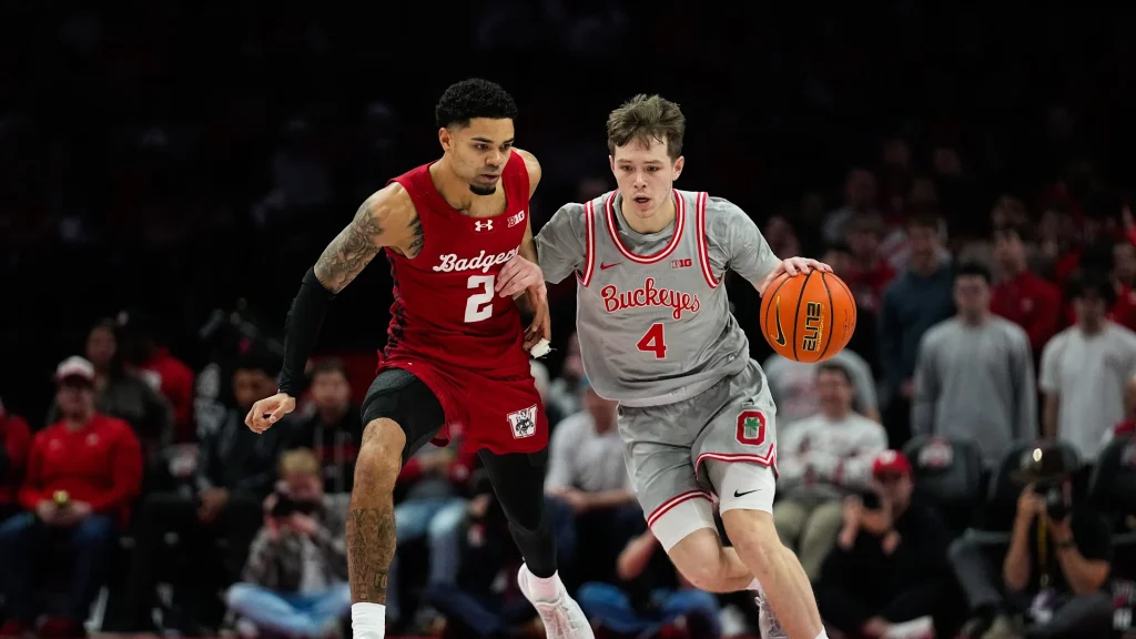 Ohio State Buckeyes guard Gabe Cupps (4) dribbles the ball against Wisconsin Badgers guard Nick Boyd (2) in the second half of the NCAA game at Value City Arena on Tuesday, Feb. 17, 2026 in Columbus, Ohio. | Samantha Madar/Columbus Dispatch / USA TODAY NETWORK via Imagn Images