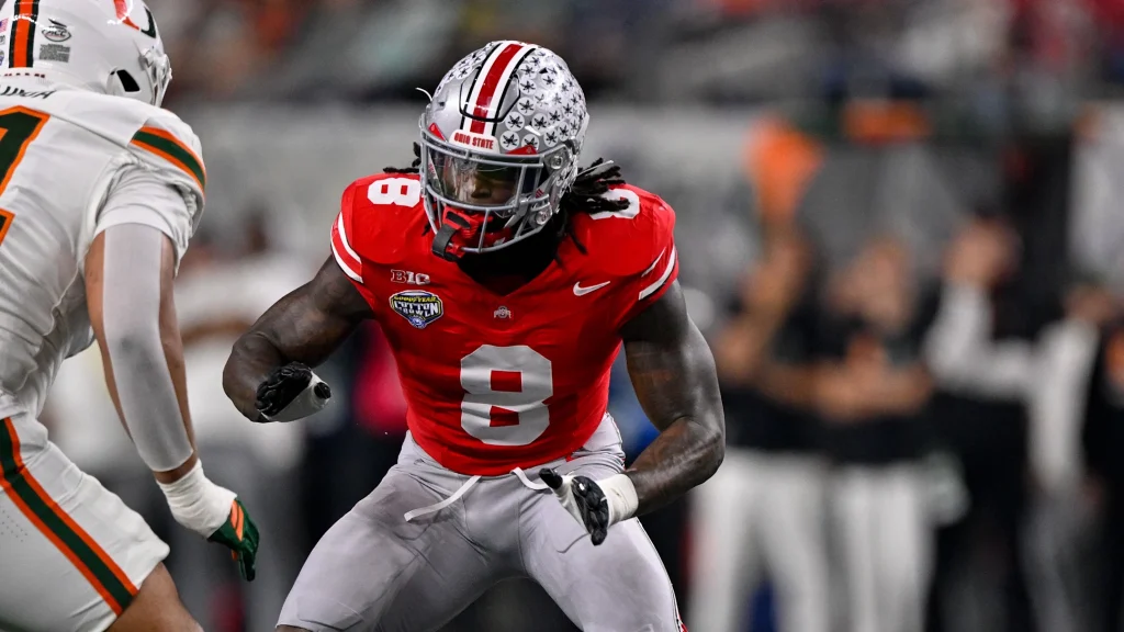 Dec 31, 2025; Arlington, TX, USA; Miami Hurricanes offensive lineman Francis Mauigoa (61) blocks Ohio State Buckeyes linebacker Arvell Reese (8) during the 2025 Cotton Bowl and quarterfinal game of the College Football Playoff at AT&T Stadium. Mandatory Credit: Jerome Miron-Imagn Images | Jerome Miron-Imagn Images