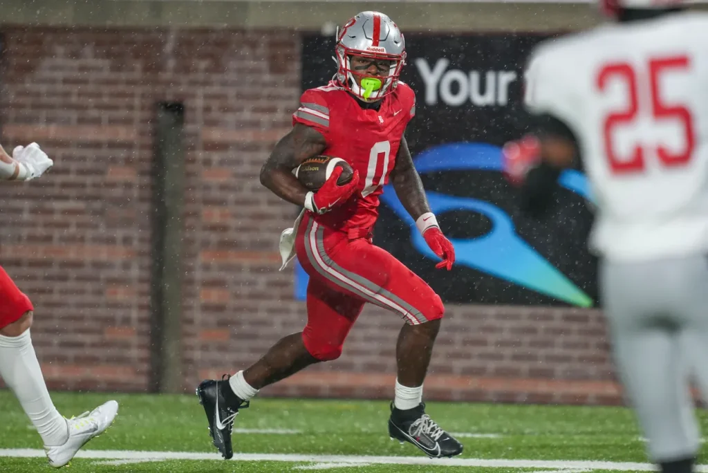 Baylor's David Gabriel Georges (0) carries the ball in the end zone for a touchdown during the Division II-AAA championship game at Finley Stadium in Chattanooga, Tenn., on Dec. 4, 2025. Angelina Alcantar/News Sentinel