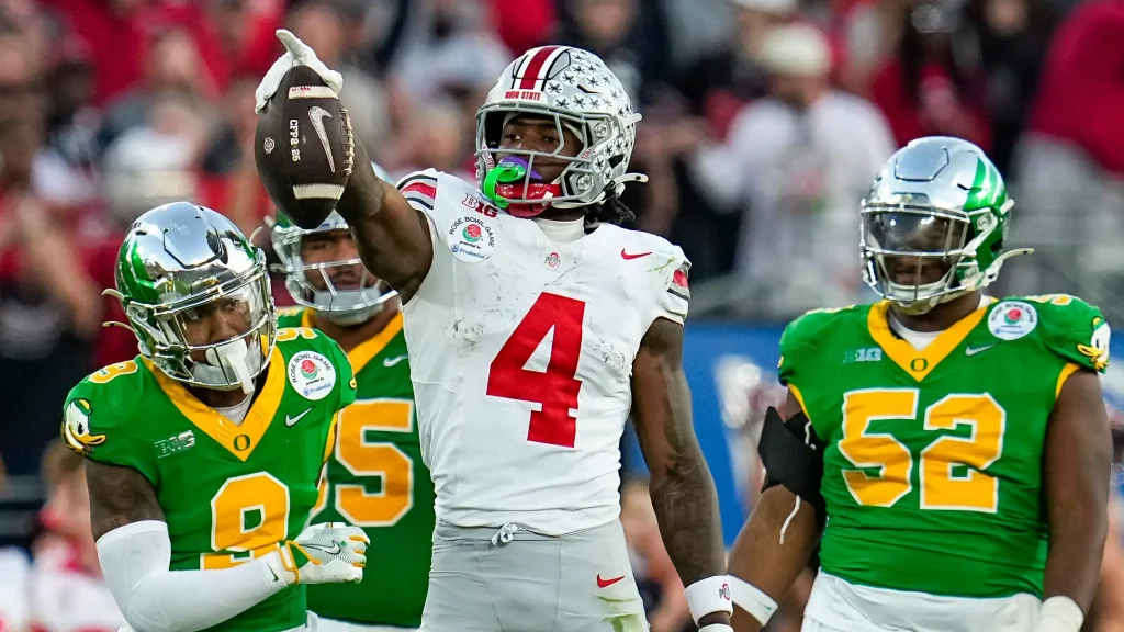 Ohio State Buckeyes wide receiver Jeremiah Smith (4) celebrates a first down catch during the second half of the College Football Playoff quarterfinal against the Oregon Ducks at the Rose Bowl in Pasadena, Calif. on Jan. 1, 2025. Ohio State won 41-21. | Adam Cairns/Columbus Dispatch / USA TODAY NETWORK via Imagn Images