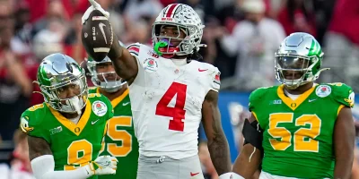 Ohio State Buckeyes wide receiver Jeremiah Smith (4) celebrates a first down catch during the second half of the College Football Playoff quarterfinal against the Oregon Ducks at the Rose Bowl in Pasadena, Calif. on Jan. 1, 2025. Ohio State won 41-21. | Adam Cairns/Columbus Dispatch / USA TODAY NETWORK via Imagn Images