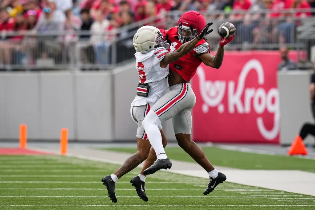 Wide receiver Jeremiah Smith (4) attempts to catch the ball against Cornerback Devin Sanchez (6) in the first half of the Ohio State football spring game at Ohio Stadium on Saturday, April 18, 2026 in Columbus, Ohio. Samantha Madar/Columbus Dispatch