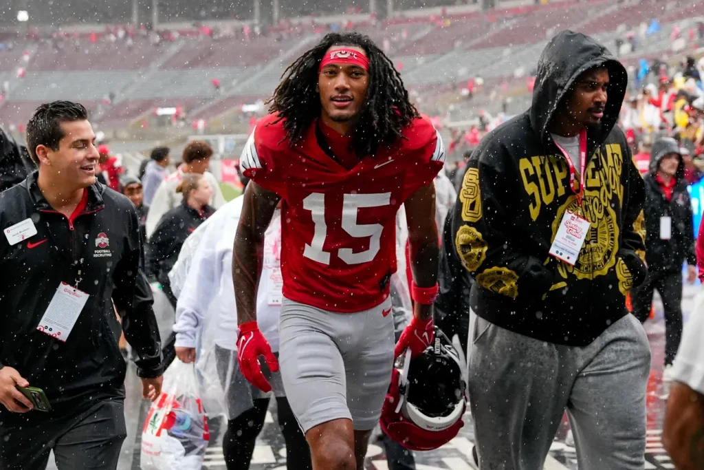 Wide receiver Chris Henry Jr. (15) walks off the field in the rain after the Ohio State football spring game at Ohio Stadium on Saturday, April 18, 2026 in Columbus, Ohio. Samantha Madar/Columbus Dispatch