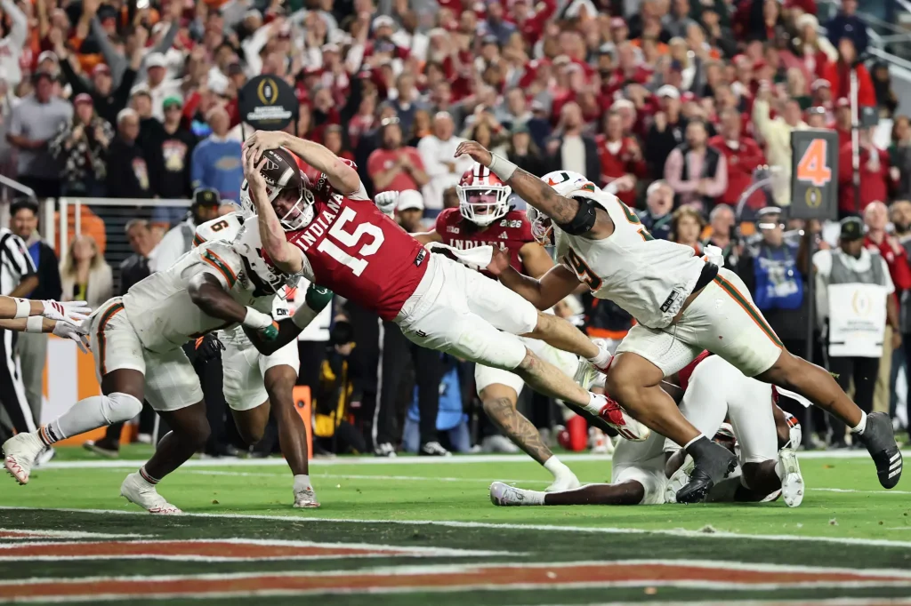 Indiana quarterback Fernando Mendoza dives across the goal line for a touchdown during the Hoosiers’ 27-21 win over Miami for the College Football Playoff national championship on Monday night. (Carmen Mandato / Getty Images)