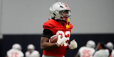 Ohio State Buckeyes running back Isaiah West (32) runs during practice at Highland Park High School in Dallas prior to the College Football Playoff matchup against the Miami (FL) Hurricanes on Dec. 29, 2025. | USA TODAY Network via Reuters Connect
