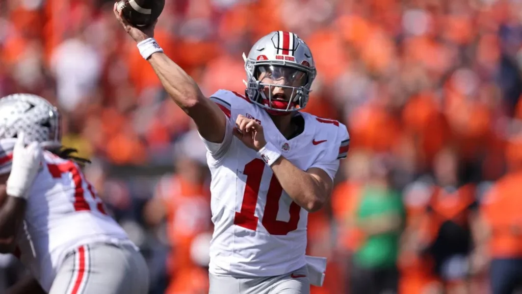 Ohio State quarterback Julian Sayin (10) passes the ball during an NCAA football game on Saturday, Oct. 11, 2025, in Champaign, Ill. (AP Photo/Melissa Tamez)