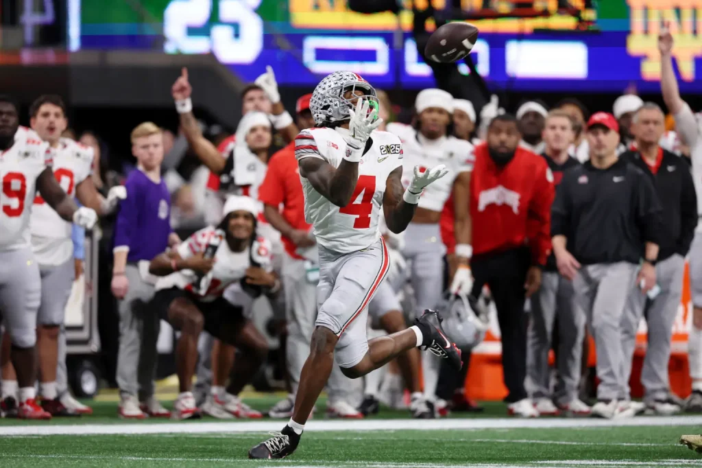 Buckeyes wide receiver Jeremiah Smith (4) makes a catch against the Notre Dame Fighting Irish during the second half the CFP National Championship. USA TODAY Sports via Reuters Connect
