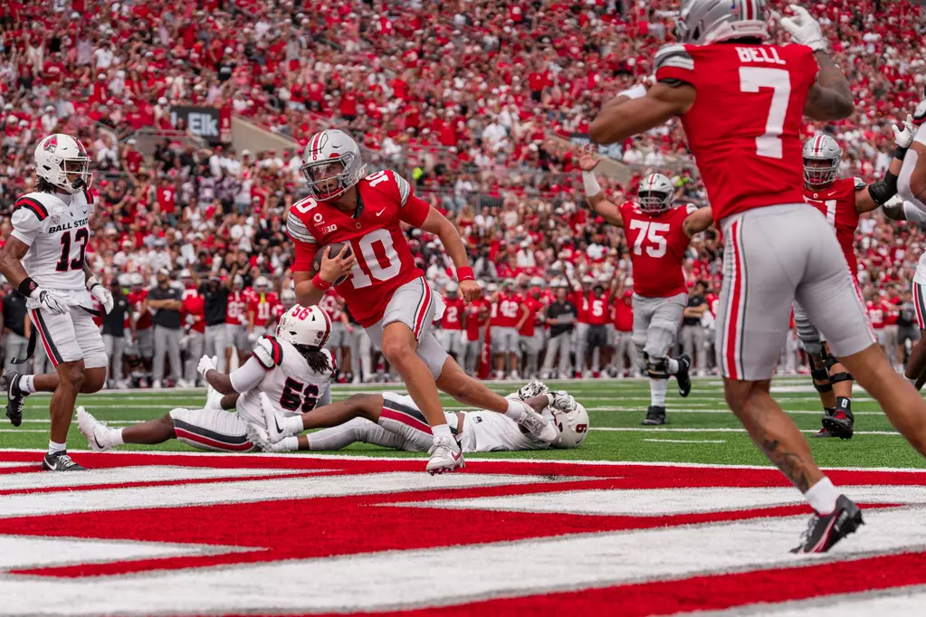 Ohio State quarterback Julian Sayin scoring a rushing touchdown against Ball State | Image Credit: Ohio State Football