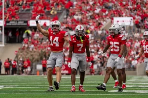 Ohio State cornerback Jermaine Mathews, linebacker Christian Alliegro, and nickel Jay Timmons against Ball State | Image Credit: Ohio State Football