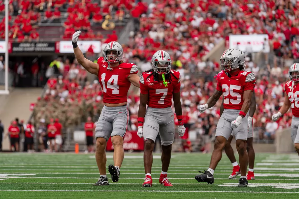 Ohio State cornerback Jermaine Mathews, linebacker Christian Alliegro, and nickel Jay Timmons against Ball State | Image Credit: Ohio State Football