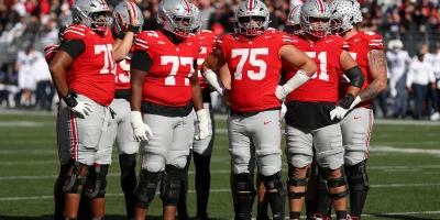 COLUMBUS, OH - NOVEMBER 01: Ohio State Buckeyes offensive lineman Phillip Daniels (70) stands with Tegra Tshabola (77), Carson Hinzman (75), and Luke Montgomery (51) during the game against the Penn State Nittany Lions and the Ohio State Buckeyes on November 1, 2025, at Ohio Stadium in Columbus, OH. (Photo by Ian Johnson/Icon Sportswire via Getty Images) Icon Sportswire via Getty Images