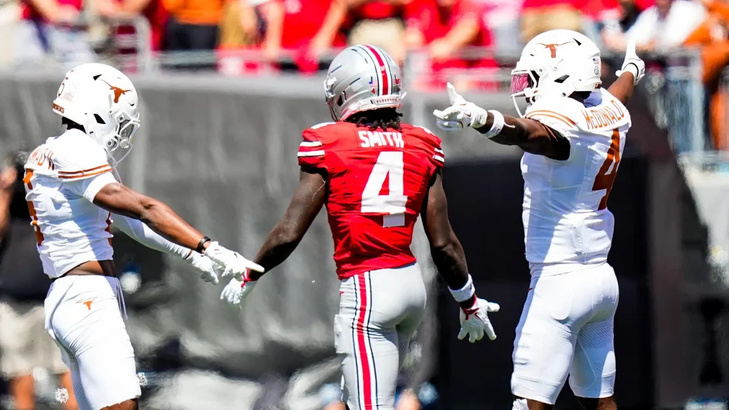 Texas Longhorns defensive back Malik Muhammad (5) and defensive back Jelani McDonald (4) react after Ohio State Buckeyes wide receiver Jeremiah Smith (4) dropped a pass in the second half at Ohio Stadium on Saturday, Aug. 30, 2025 in Columbus, Ohio. | USA TODAY Network via Reuters Connect