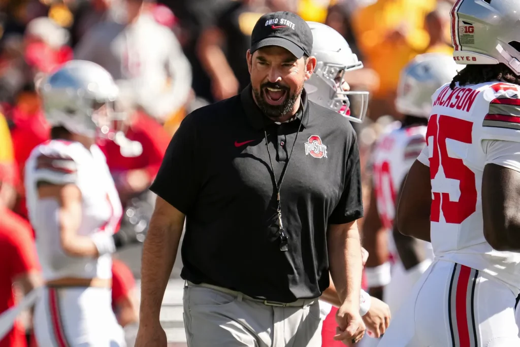 Ohio State Buckeyes head coach Ryan Day leads warm ups prior to the NCAA football game against the Iowa Hawkeyes at Kinnick Stadium in Iowa City on Oct. 3, 2026. Adam Cairns/Columbus Dispatch