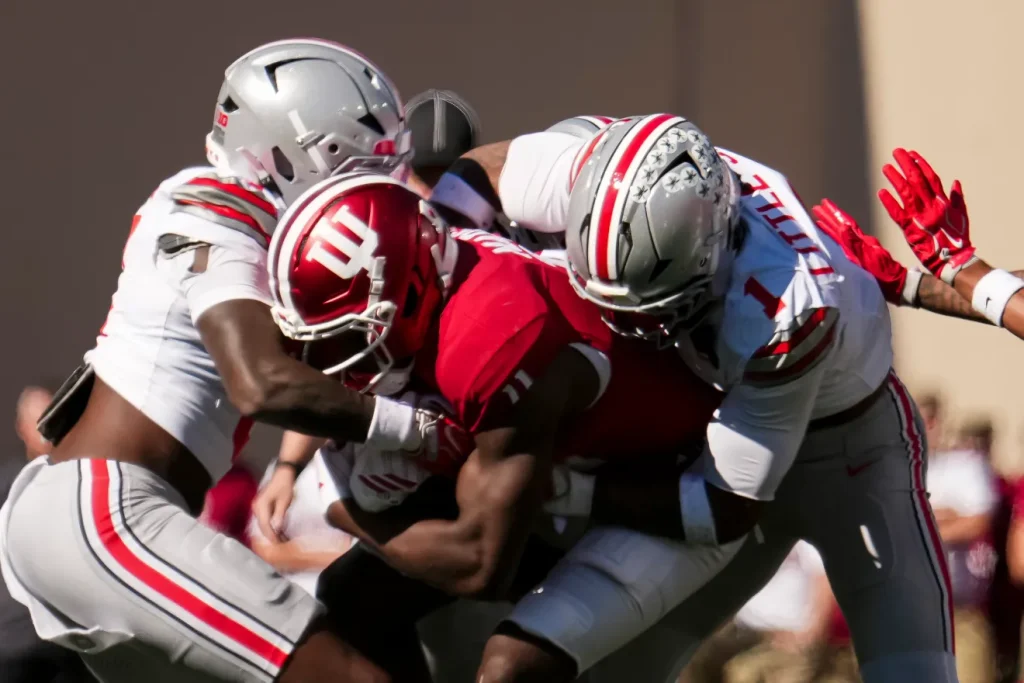 Ohio State Buckeyes safety Earl Little Jr. (1) tackles Indiana Hoosiers wide receiver Nick Marsh (11) during the NCAA football game at Memorial Stadium Stadium in Bloomington, Ind. on Oct. 17, 2026. Adam Cairns/Columbus Dispatch