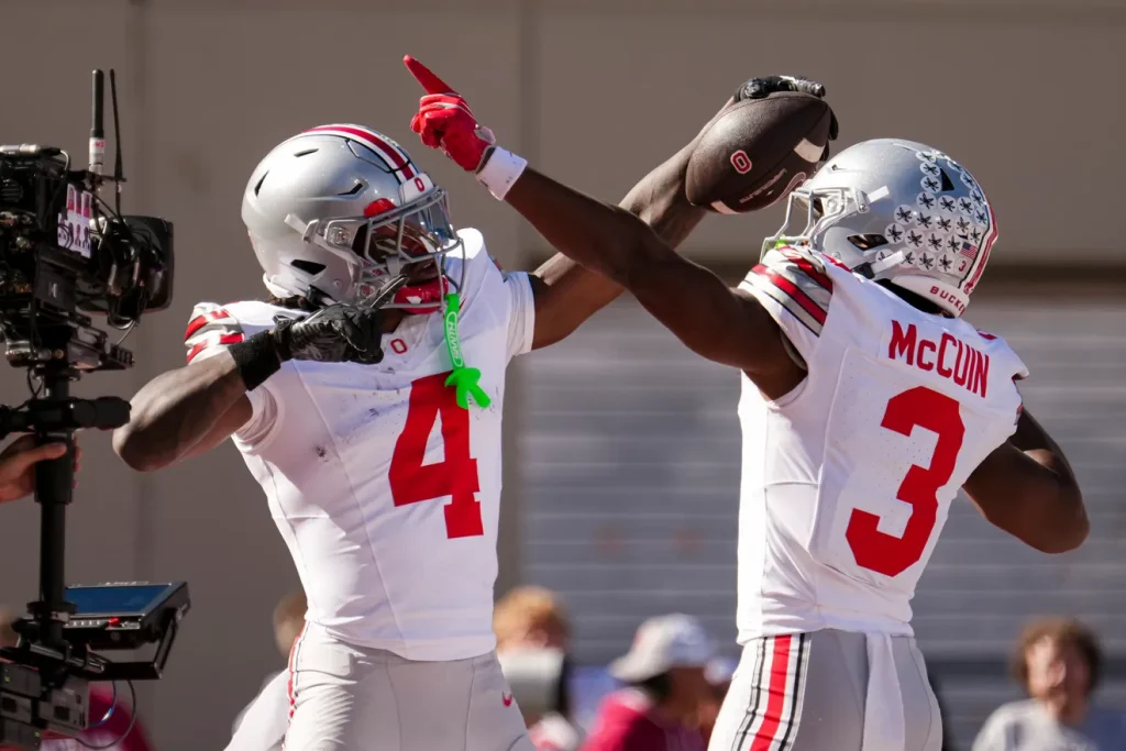 Ohio State Buckeyes wide receiver Jeremiah Smith (4) celebrates a touchdown with with wide receiver Devin McCuin (3) during the NCAA football game against the Indiana Hoosiers at Memorial Stadium Stadium in Bloomington, Ind. on Oct. 17, 2026. Adam Cairns/Columbus Dispatch