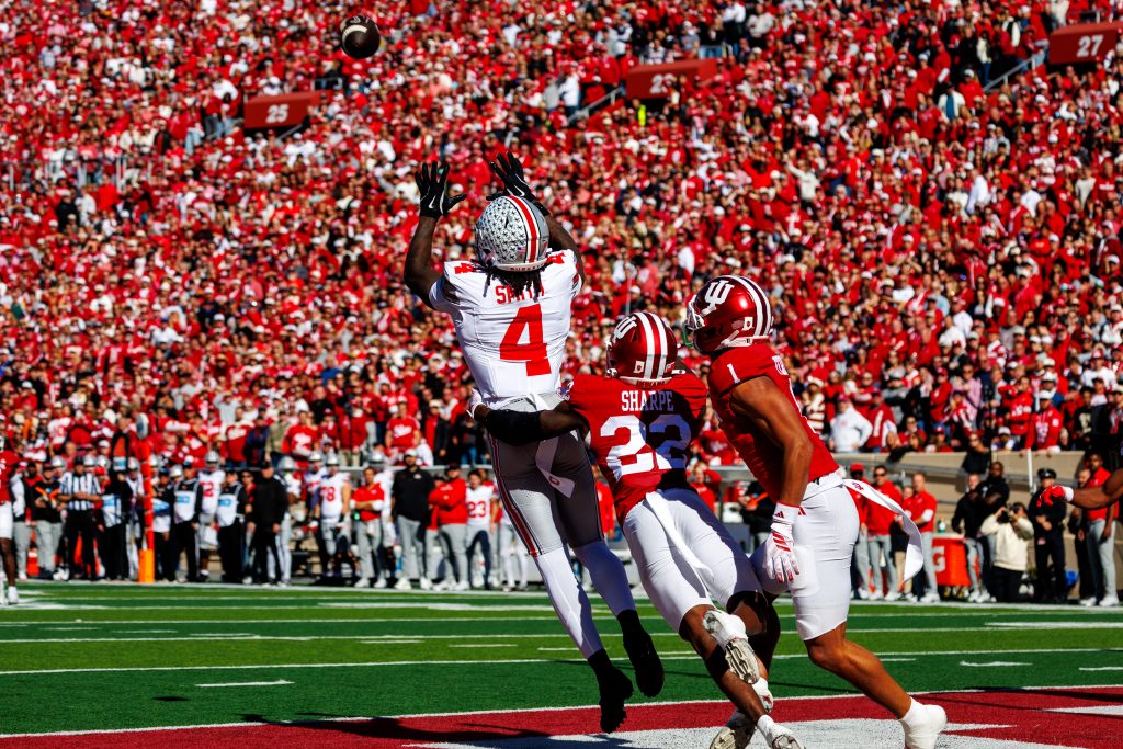 Ohio State now finds itself squarely in a six-week gauntlet that has been anticipated since the release of the 2026 schedule. The stretch will unfold as follows post-Indiana: BYE, @USC and then Oregon, Northwestern, @Nebraska and Michigan. With Northwestern being one of the biggest surprises in college football this year, all five of OSU’s remaining opponents sit inside the top 32 in the FPI rankings as of this week. We are going to find out what this OSU team is truly made of as depth will be as important as ever. Improved Discipline Ohio State ranks 68th in the country when it comes to penalties per game, averaging nearly 7 per game. The matchup against Maryland was no exception either as OSU committed 8 penalties for 65 yards and Ryan Day was not hiding his displeasure on the sidelines throughout the contest. On one particular drive, a roughing the passer penalty bailed Maryland out on third down. Then on following drive, Maryland found some succcess moving the ball into their red zone. When the Buckeyes had a chance to bow up and force a field goal, they instead committed back-to-back penalties that allowed the Terps to easily punch it in and cut OSU’s lead to 14-10 early. Against Indiana, Ohio State only committed 4 penalties, but they were costly ones. Jermaine Mathew’s roughing the passer. Holding call to take the offense out of field goal range and Luke Fahey’s intentional grounding were all costly mistakes. Even though OSU came out with the win, there was a slew of errors that kept Indiana within striking distance all game. OSU’s depth was certainly tested against Indiana. The status of Julian Sayin is still unknown and coach Day as alluded to the fact that they trust Luke Fahey moving forward. With that said, Ryan Day wants his team to be a “four quarter” football team. Being able to sustain focus and play smart football for four quarters will be a major key to watch if Ohio State wants to take care of business during this stretch, no matter who ends up taking the field for Coach Day. Otherwise, The Buckeyes could find themselves unable to manage or finish games during a period of time where they can’t afford to. Sustain Run Game Arthur Smith offenses are notorious for being with predicated on and creative in the run game, going back to his days calling plays for the Tennessee Titans with Derick Henry. Although OSU got off to a fairly slow start running the ball this year, the results have steadily improved, particularly in Big Ten play. In the past four games, Ohio State’s leading rushers (Bo Jackson, Ja’Kobi Jackson and/or Isaiah West) have combined for 109, 142, 183 and then 101 yards against a stout Indiana run defense. Considering The Buckeyes are now depending on backup QB Luke Fahey for the foreseeable future, have this run game peaking at the right time is essential. Keeping the pressure off of Fahey and not allowing defenses to pin their ears back on him is a must moving forward. With that, the offense should be able to operate at a high enough level to make it through the regular season as a playoff team, assuming Luke is able to protect the football. Defense Wins Championships What Matt Patricia has been able to do with his unit after losing so much talent to the NFL has been remarkable. Ohio State’s defense currently ranks No. 4 nationally in both opponent yards (264.3) and opponent points per game (13.4). It wasn’t always easy for the defense, as pass rush was a major issue up until Big Ten play and the Illinois game exposed the defense with a handful of big plays. However, since then this unit has essentially been lights out. The pass rush, although not quite where it needs to be, has improved dramatically. Particularly with the surge of guys like Qua Russaw and Eddrick Houston. Defensive Back blitzes have also been a useful way to apply pressure, as evident with Jaylen McClain making a huge strip sack against Indiana and even Jermaine Mathews hitting Josh Hoover on the questionable roughing the passer penalty. Being able to successfully apply this pressure was the missing link in what has now become an elite defensive unit. With so much unknown and inexperience leading the offense, this defense will be even more important. If the offense isn’t able to sustain success or takes time to gel under Fahey, The Buckeyes may have to win games with defense, much like they arguably did in Bloomington. Ohio State certainly has their work cut out for them as they navigate the next five games with a winded roster. Injuries are part of the game though and any team on OSU’s schedule is going to dedicate game plans to exploit this. The coaching staff has done an exceptional job thus far, but the challenges have only grown in difficulty. This bye week couldn’t come at a better time for the Buckeyes.