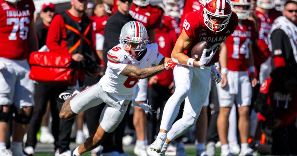Ohio State cornerback Devin Sanchez (6) reaches for Indiana wide receiver Charlie Becker (80) during the second half of an NCAA college football game, Saturday, Oct. 17, 2026, in Bloomington, Ind. Doug McSchooler - FR170771 AP