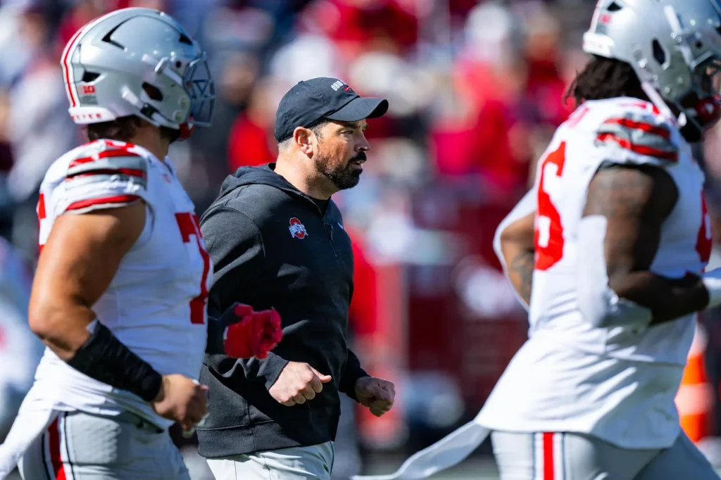 Ohio State coach Ryan Day runs onto the field before the second half against Indiana on Oct. 17. (Doug McSchooler/TheAssociated Press)